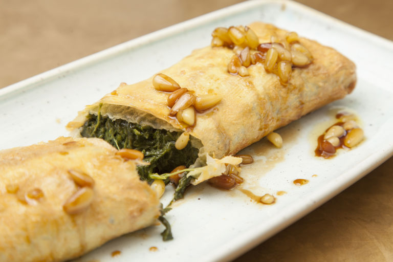 Empanada with spinach, Torta del Casar and pine nut dressing