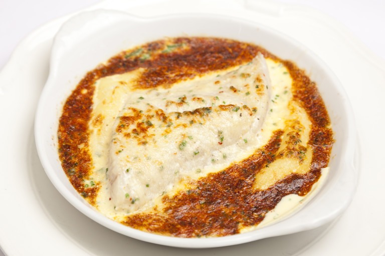Smoked haddock baked with Parmesan and peas