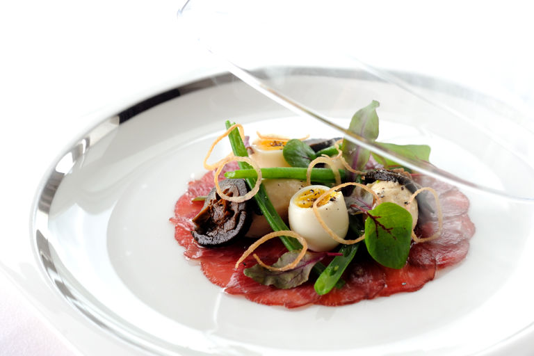 Lightly smoked plate of lamb carpaccio with shallot mousse, pickled walnut and quails eggs