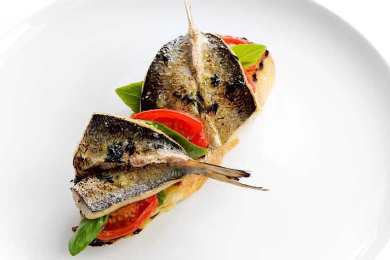 Grilled sardines on ciabatta with tomato confit, basil and tapenade
