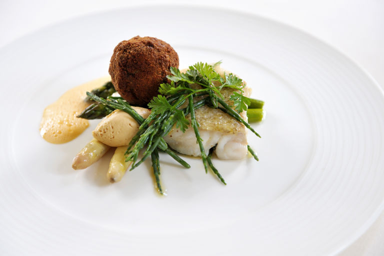 Seared cod with asparagus, crab beignets and samphire