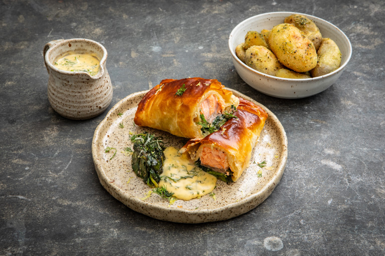 Salmon en croûte with garlic spinach and dill hollandaise