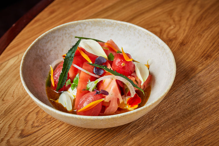 Tomato salad with spiced ricotta and curry oil