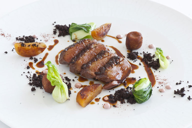 Tandoori duck breast with duck croquettes, apricots and pak choi