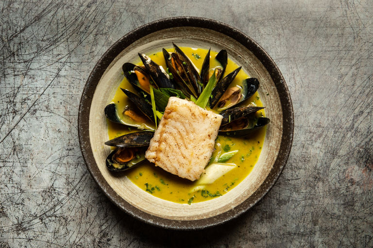 Pan-fried hake with curried mussels