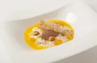 Chilled rice pudding with chocolate sorbet, mandarin soup and macadamia nut tuille