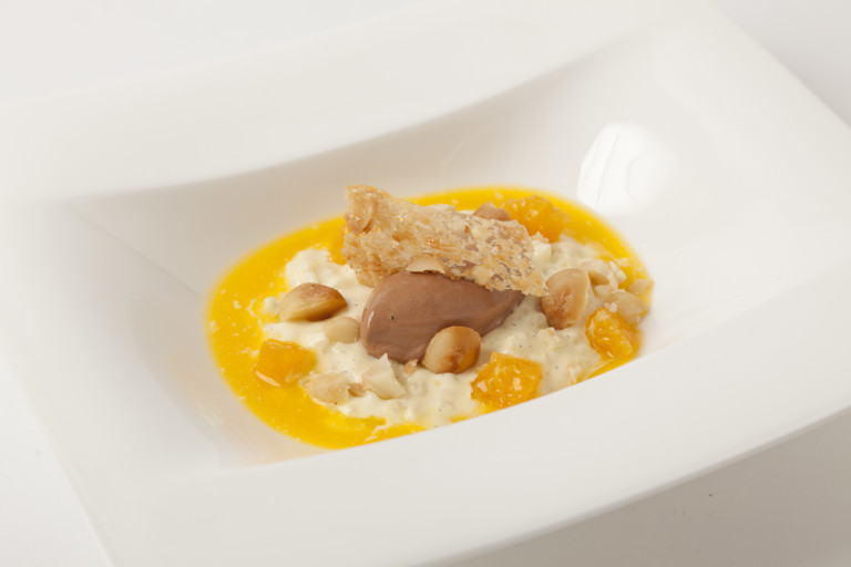 Chilled rice pudding with chocolate sorbet, mandarin soup and macadamia nut tuille
