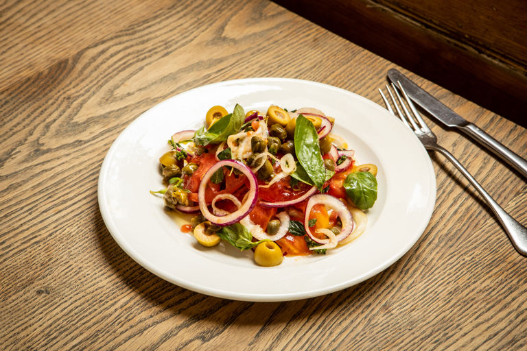 Aeolian-style salad with tomatoes, capers and anchovy-stuffed green olives