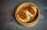 Southern fried chicken bao buns with creamed corn and hot sauce