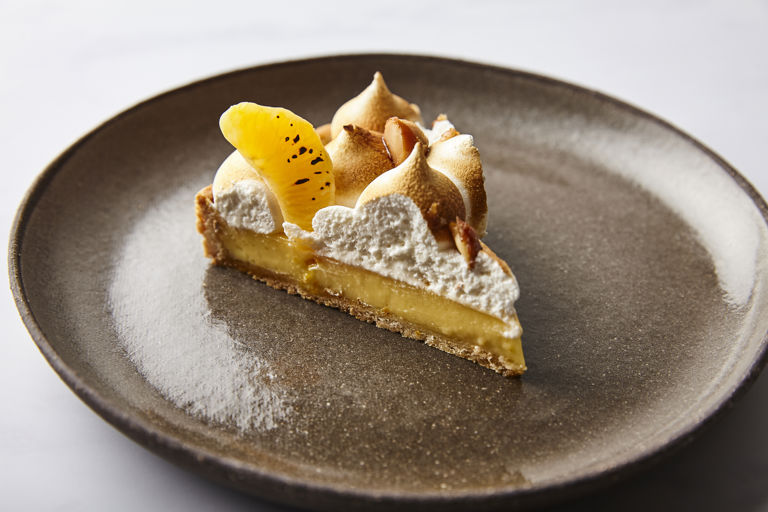 Clementine tart with Italian meringue and caramelised macadamias