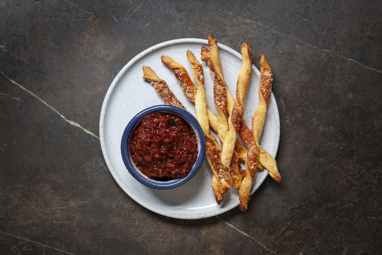 Tomato, pancetta and truffle jam with Parmesan puff pastry sticks