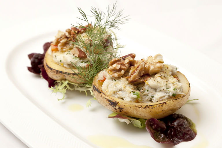 Baked potatoes with crab and walnuts