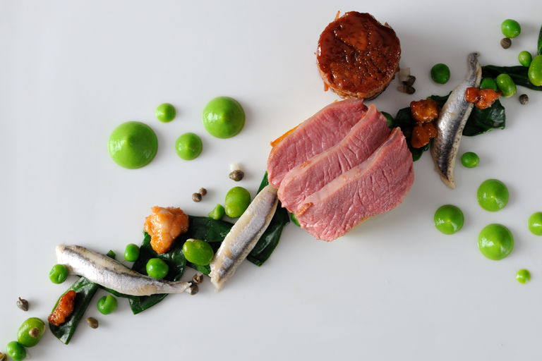 Lamb rump with wild garlic, anchovy and pea purée 