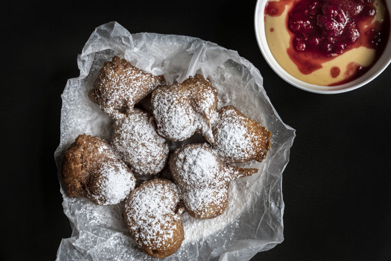 Beignets with custard and berries