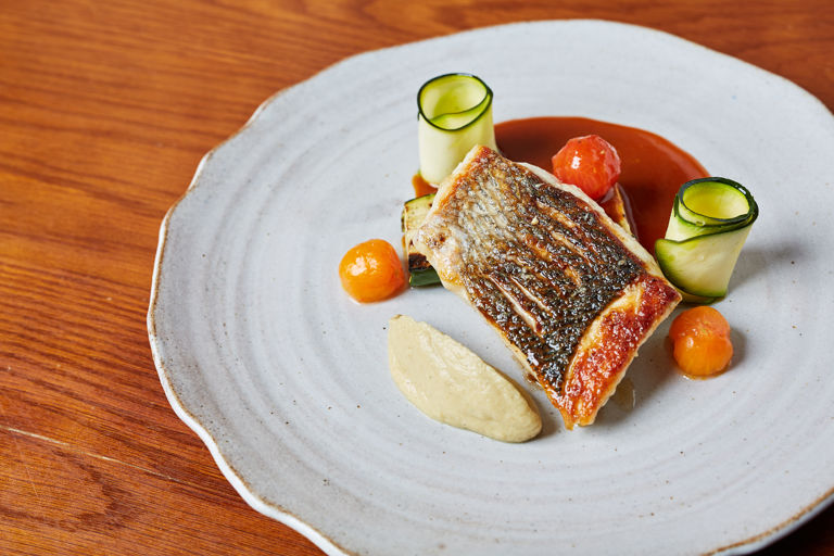 Wild bass with smoked aubergine purée and bouillabaisse sauce