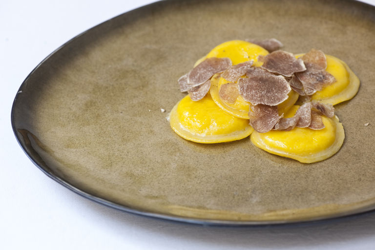 Egg yolk ravioli with truffle and Parmesan