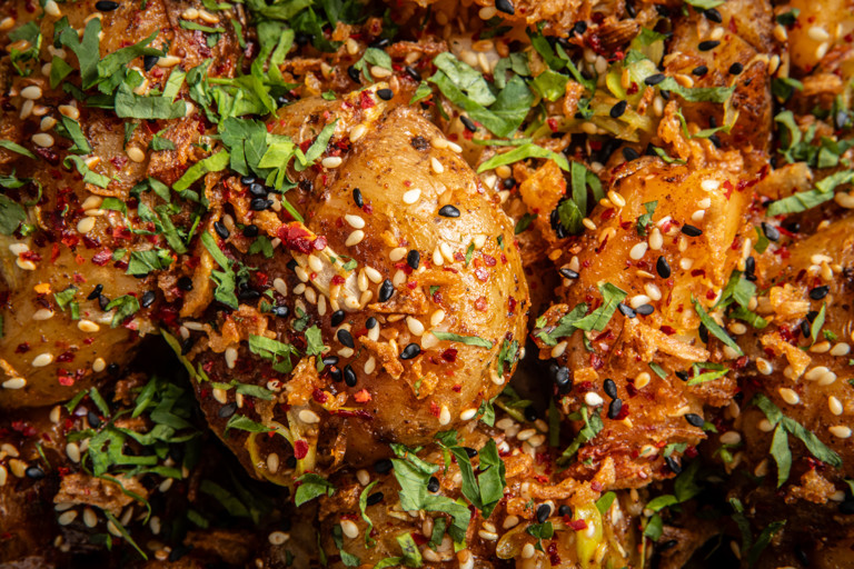 Smashed potatoes with lime and chilli chutney and herby yoghurt dip