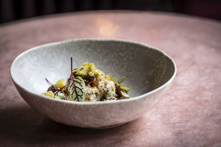 Roast cauliflower with cauliflower kimchi and pickled raisins