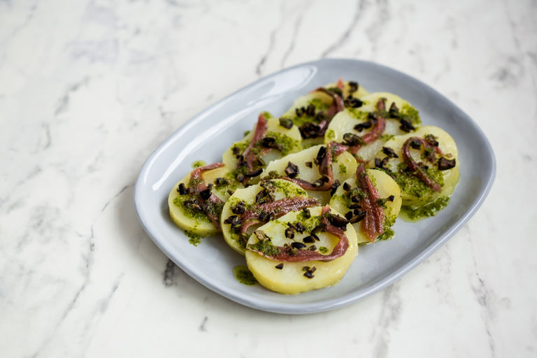 Potato dischetti with anchovy and capers