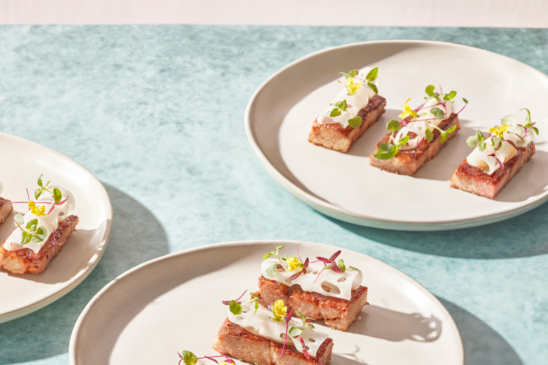 Torched barbecue pork with málà lotus root slices, preserved plum