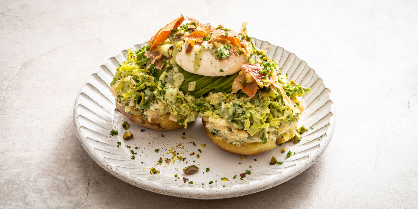 Loaded jacket potatoes with green goddess dressing, plated