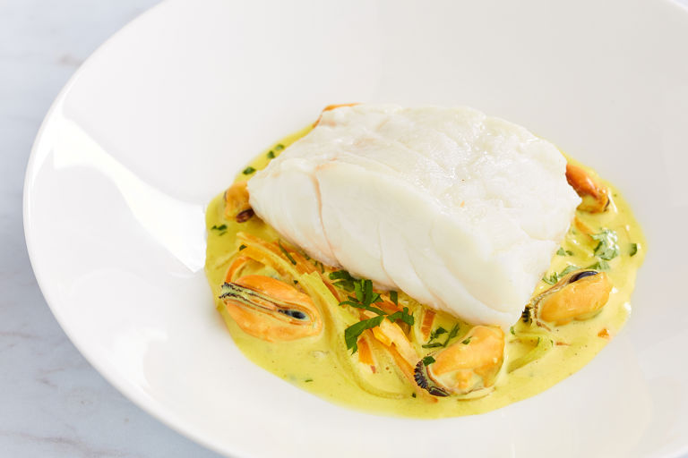 Steamed cod with curried mussels and carrots