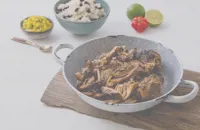 Jerk pork shoulder with mango salsa and rice and peas