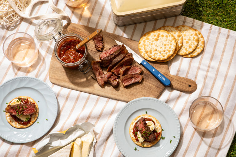 Sliced ribeye with brie and tomato-chipotle jam