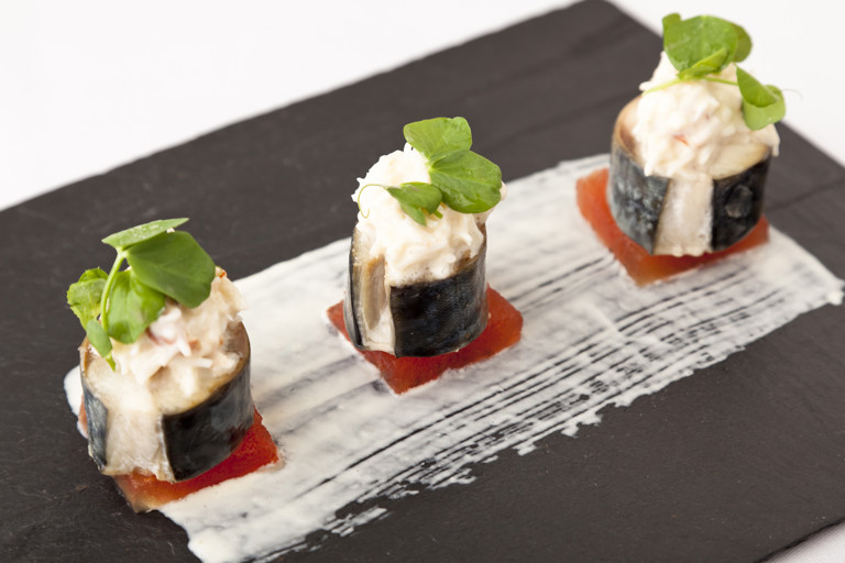 Mackerel with compressed watermelon, crab and horseradish salad