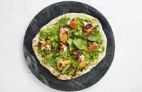 Pea and broad bean flatbread with chicken skin, sansho pepper crema and grilled chicken thigh