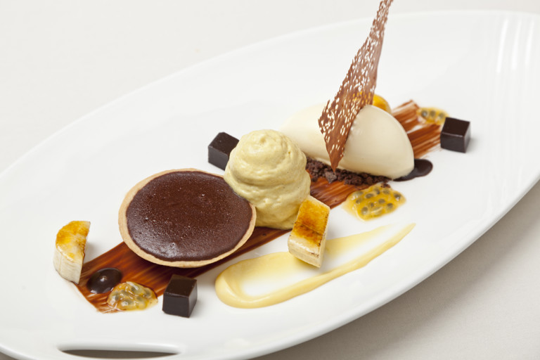 Hot chocolate tart with banana and passion fruit ice cream