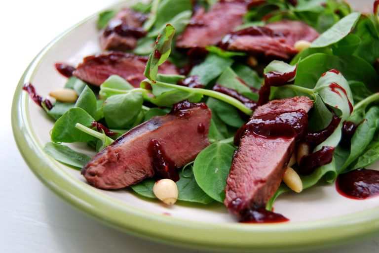 Wood pigeon salad with raspberry balsamic reduction