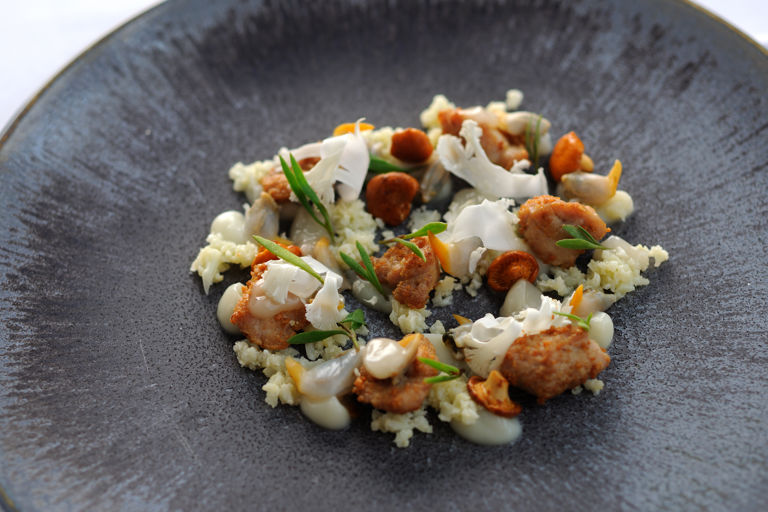 Roasted veal sweetbreads, cockles, cauliflower cous-cous and girolles
