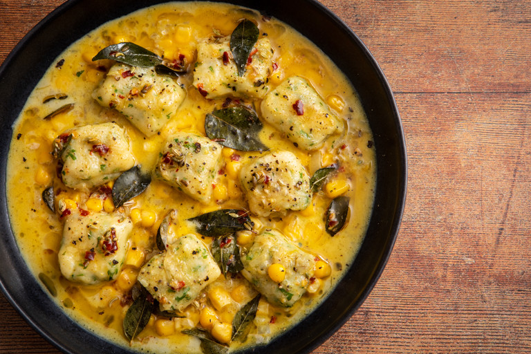 Coriander gnocchi in a curried cream and corn sauce