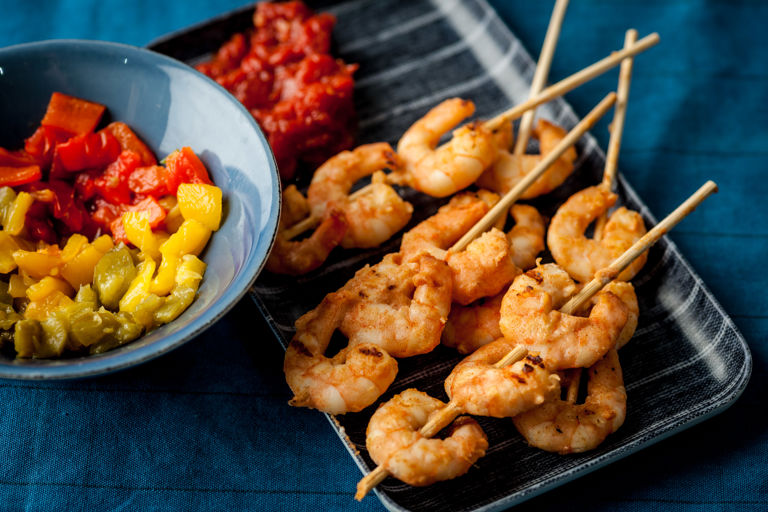 Prawn skewers with tomato chutney and roast peppers
