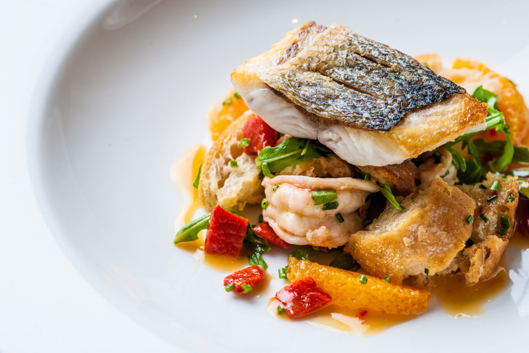 Sea bass and tiger prawn panzanella-style salad with chilli dressing