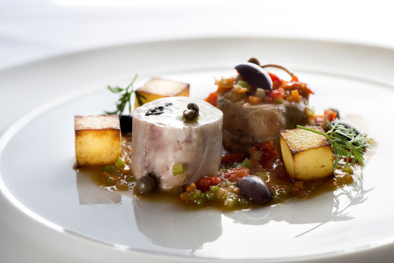 Rabbit, olives, capers, dried tomatoes, potatoes