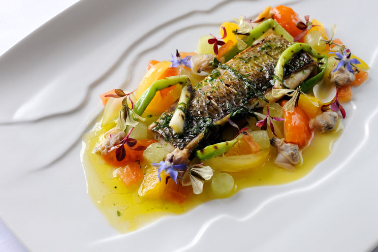 Fillet of silver mullet with grilled spring onions, cucumber, confit tomatoes and sauce vierge