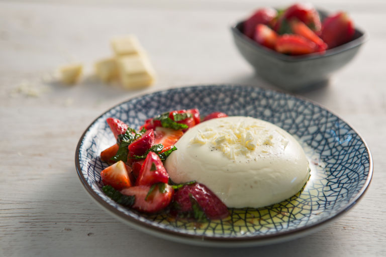 White chocolate panna cotta with lemon, mint and olive oil strawberriesimage