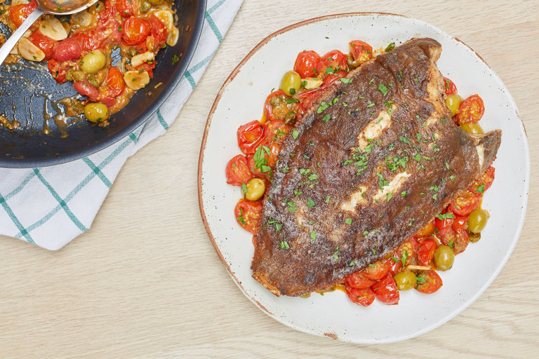 Pan-fried lemon sole with tomato, olive and caper sauce