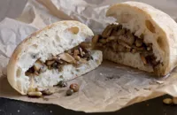 Mushroom sandwich with pine nuts, raisins and capers