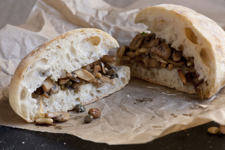 Mushroom sandwich with pine nuts, raisins and capers