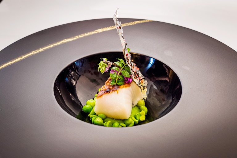 Black cod with petit pois and pea shoots