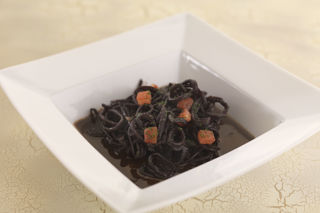 Squid braised in red wine and tomato