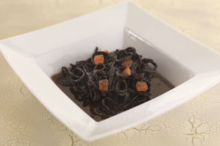 Squid braised in red wine and tomato