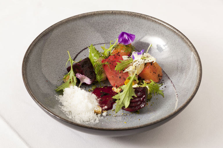 English beetroot with goat's cheese snow, oat biscuits and mizuna