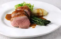 Roast duck breast with asparagus, caramelised shallot and hispi cabbage