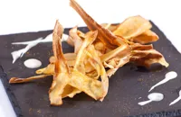 Curry salted parsnip crisps