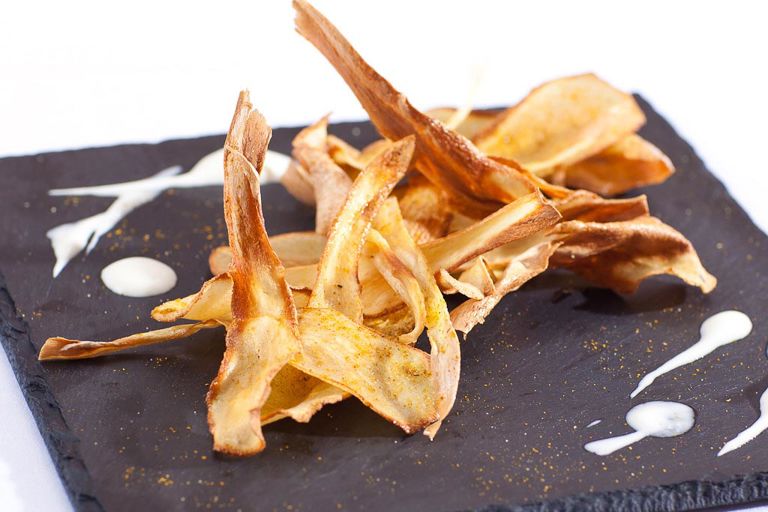 Curry salted parsnip crisps