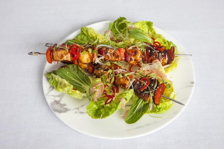 Barbecue pork belly and langoustine skewer with baby gem salad